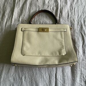 Elegant Cream Coach Handbag